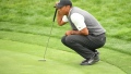 Photo: Woods 'fighting and hanging on' at US Open